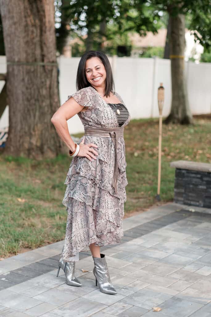 This look has everything I like. All together — high-low-cut dress cover with ruffles, snake print, unique jewelry, wide belt, shine boots, and a yellow jacket.