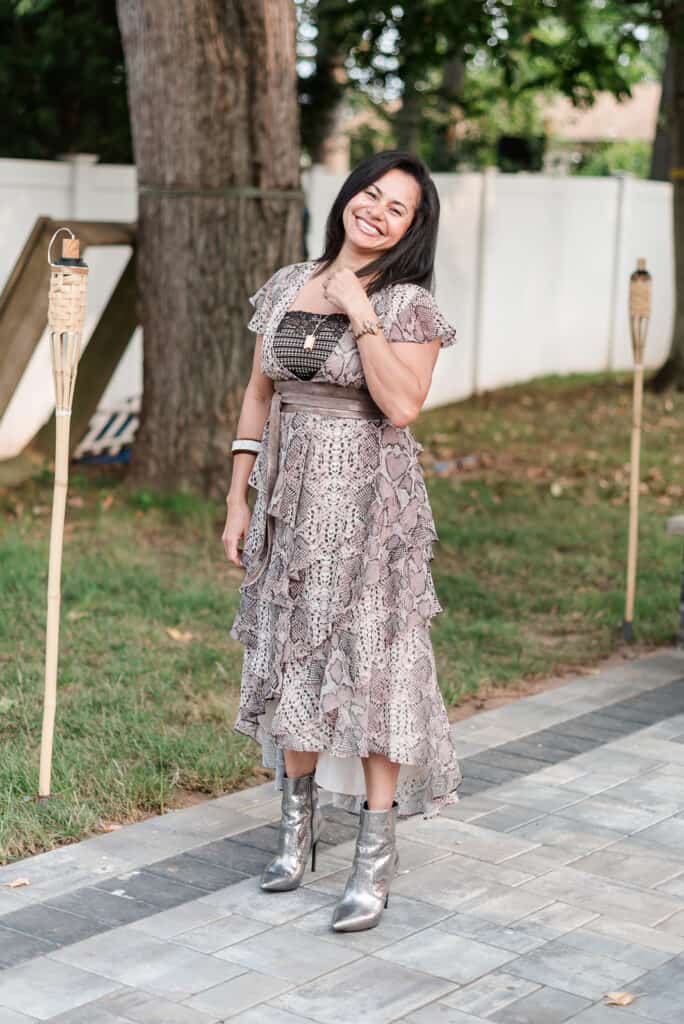 This look has everything I like. All together — high-low-cut dress cover with ruffles, snake print, unique jewelry, wide belt, shine boots, and a yellow jacket. A combination that's a bit unexpected, but wow, they are making a bold statement!